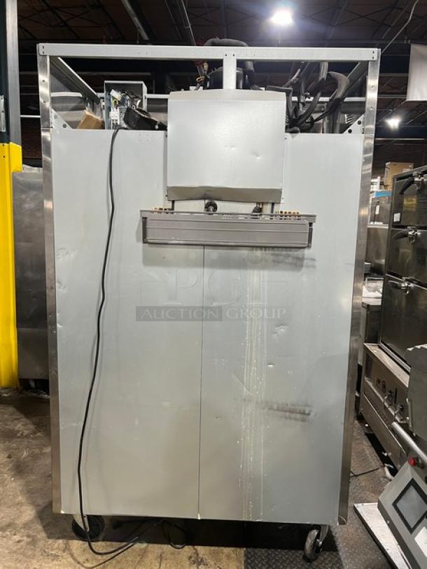 Turbo Air M3F47-2 stainless steel freezer, two-door, on commercial casters, rear view, 115V, 1 Phase, slight wear.