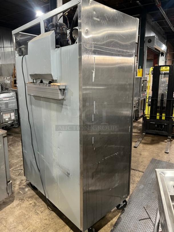 Turbo Air M3F47-2 stainless steel 2-door reach-in freezer, model M3F47-2, on commercial casters, 115V, 1 phase, showing wear.