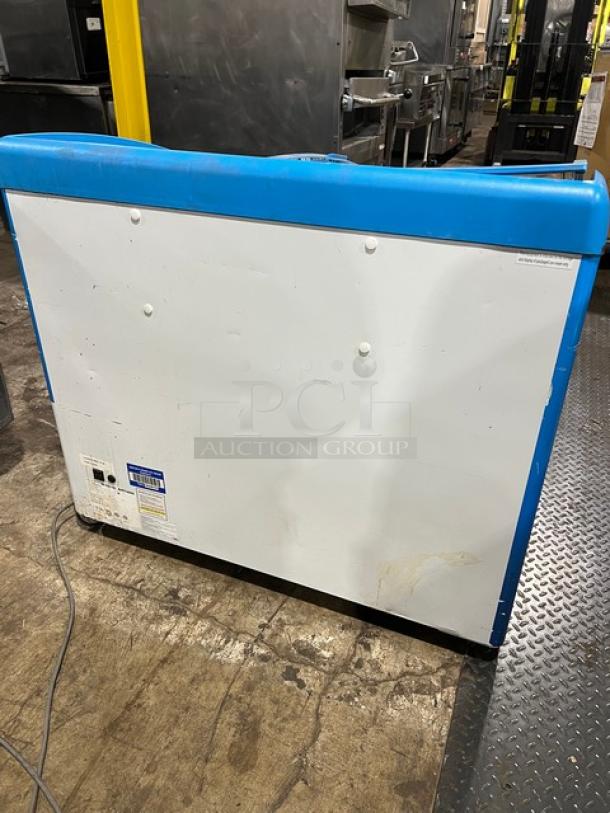 AHT RIO S100 Reach Down Freezer Merchandiser in used condition, model and serial labels visible, 120V, 1 Phase.