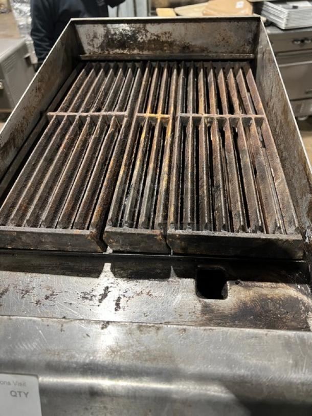 CPG Natural Gas 15" Countertop Char Broiler Grill on Legs, features sturdy grate, visible wear, ideal for commercial use.