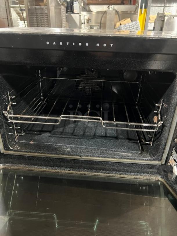 Moffat Turbo Fan E25 countertop electric convection oven, Model E25, Serial 234997, 120V, 1 Phase, labeled "Caution Hot".