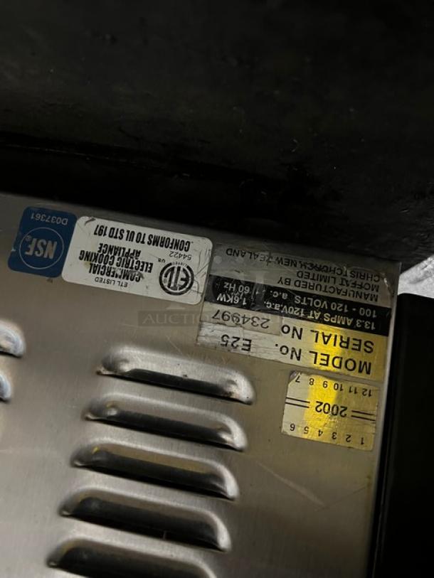 Moffat E25 convection oven label showing model E25, serial 234997, 120V, 1 phase, NSF certification, and manufacturing details.