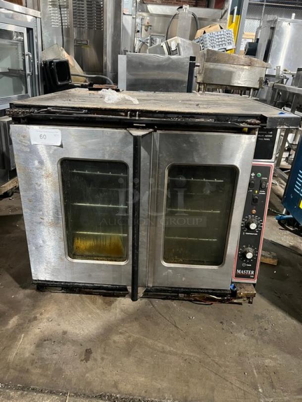 Garland Master Series 200 gas convection oven, stainless steel, dual glass doors, control panel with knobs, used condition.