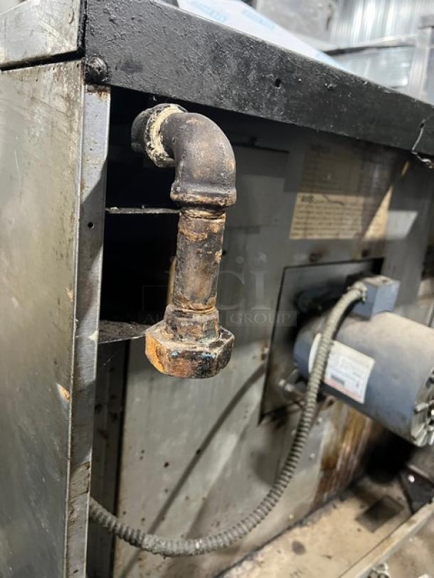 Garland Master Series 200 gas convection oven, showing rusted pipe and motor, indicates wear; model and specs on label.