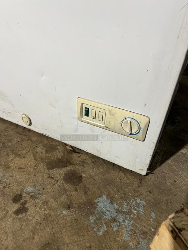 GE white deep chest freezer, model FCM7SUBWW, serial GS101196. Features control panel. Used condition. 115V, 1 phase.