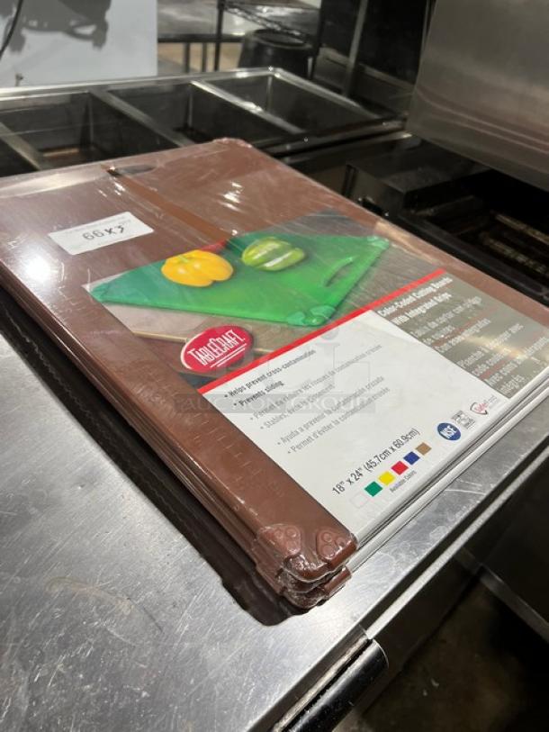 New Table Craft color-coded cutting boards, with easy grip handle, in packaging. Includes multiple boards, contact for details.