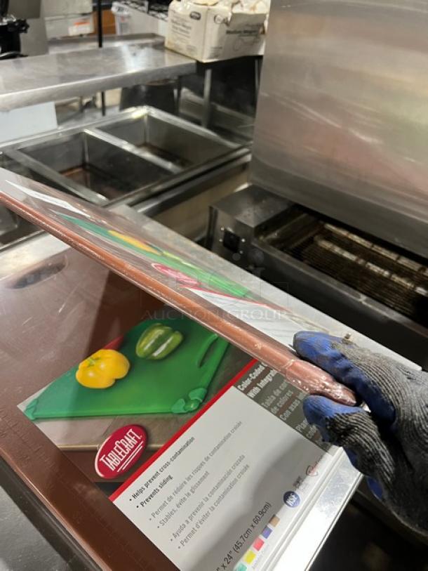 New Table Craft color-coded cutting boards with easy grip handle, in packaging. Brand label and product details visible.