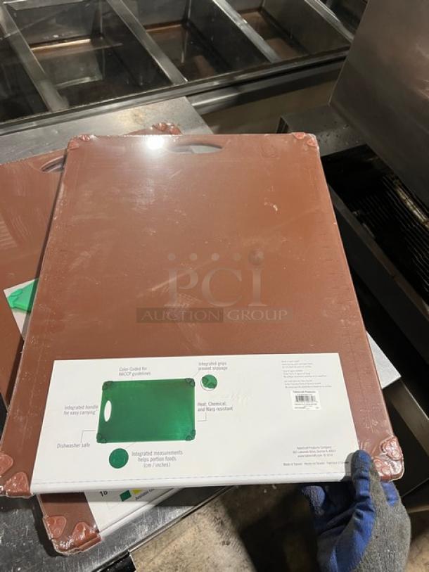 Table Craft color-coded cutting board, new, with easy grip handle. Dishwasher safe. Integrated measurements.