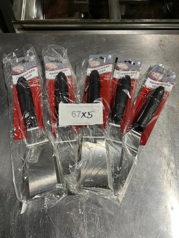 Five new Winware TKP61 hamburger turners in packaging, black handles, stainless steel blades, model name visible on tags.
