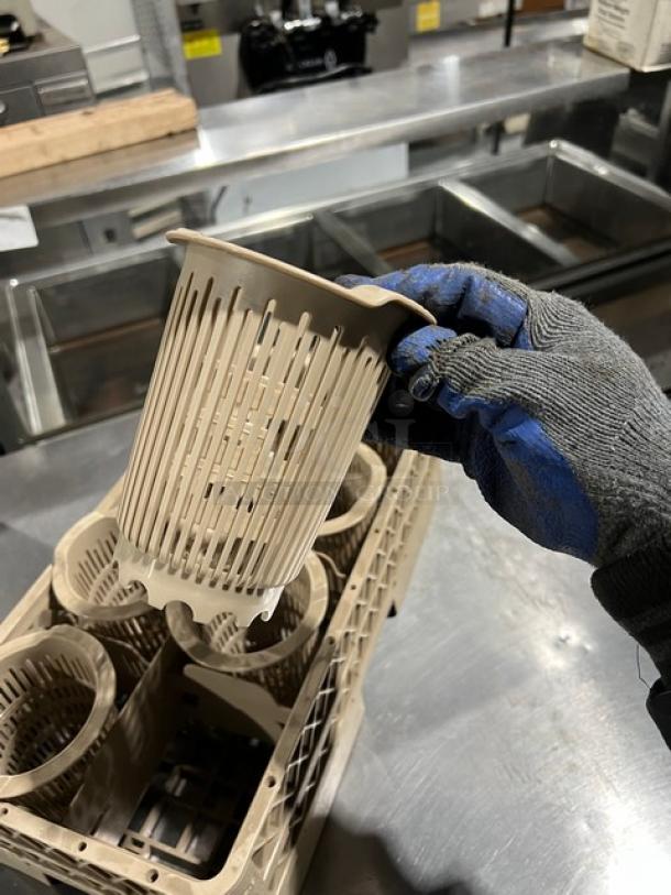 Commercial grade poly utensil dish basket, dishwasher safe, beige color, shows light use, with multiple utensil compartments.