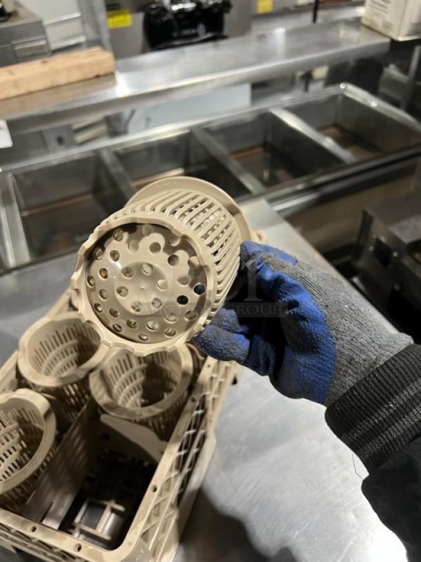 Commercial-grade poly dishwasher-safe utensil dish basket, beige, cylindrical compartments, excellent condition.