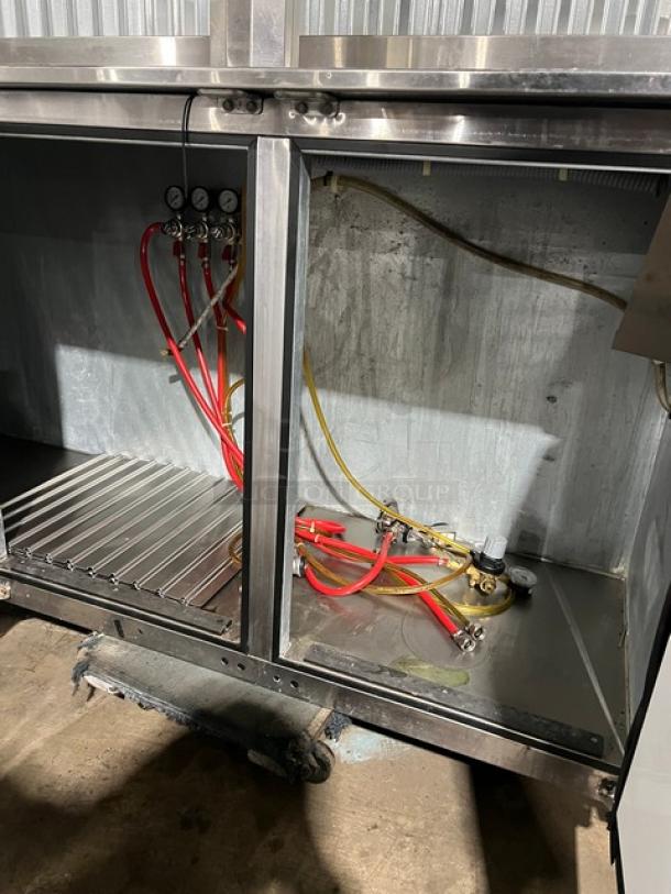 Perlick KC84-R6-SSH stainless steel kegerator with 4 tap tower, visible tubing, and gauges. Model and serial details shown.