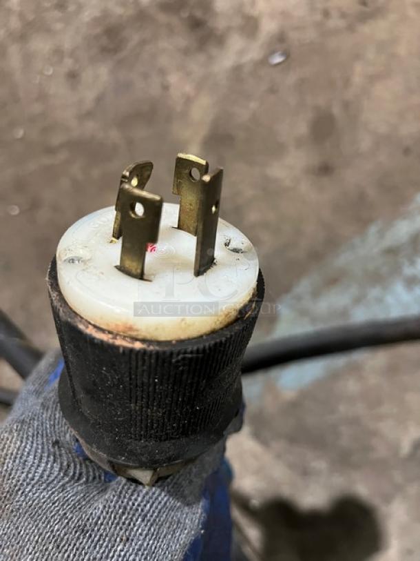 Close-up of a three-prong plug for Hatco Thermo Finisher, 208V 3-phase, showing metal prongs and black casing.