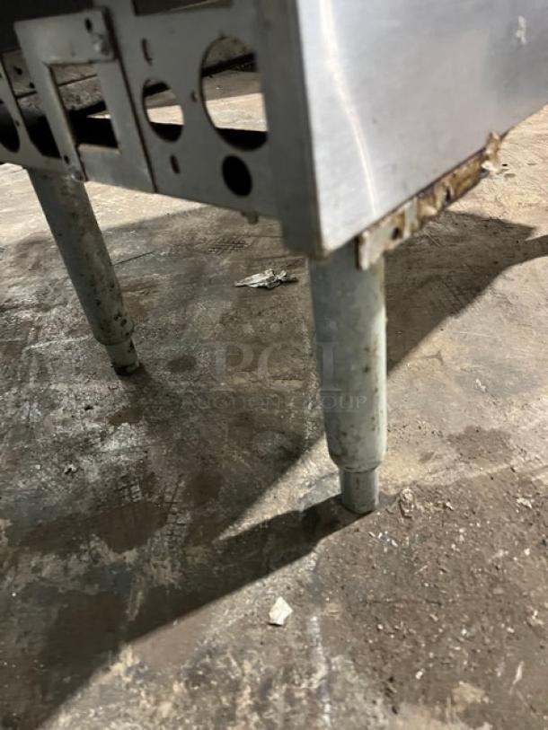 Pitco Soltice SE14T split tank electric fryer, model SE14T, on legs. Visible wear and rust on legs.