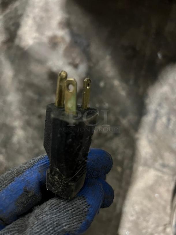 Close-up of a three-pronged power plug for the Marshall VT18 countertop electric conveyor toaster.