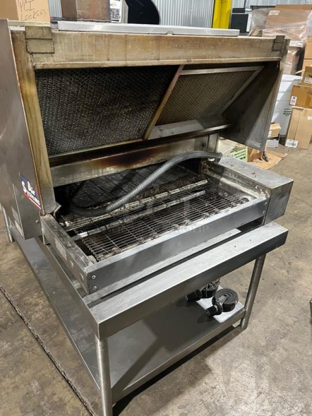 Micro Drive electric-powered stainless steel conveyor pizza oven on a steel stand with casters, showing interior and components.
