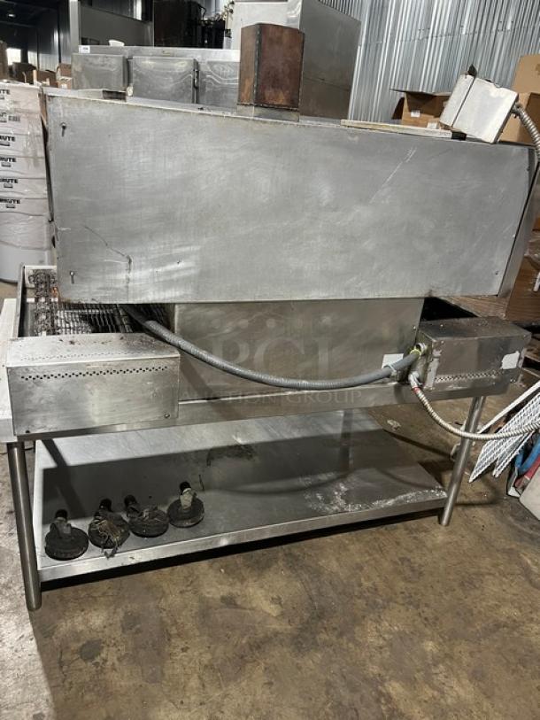 Micro Drive electric-powered stainless steel conveyor pizza oven on a stand with casters. Used condition.