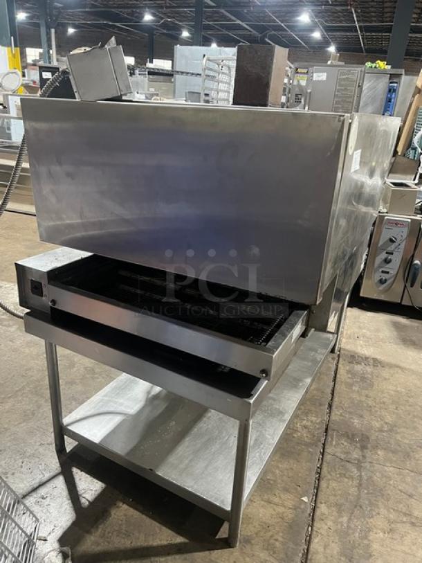 Electric Micro Drive stainless steel conveyor pizza oven on stand with casters, excellent condition.
