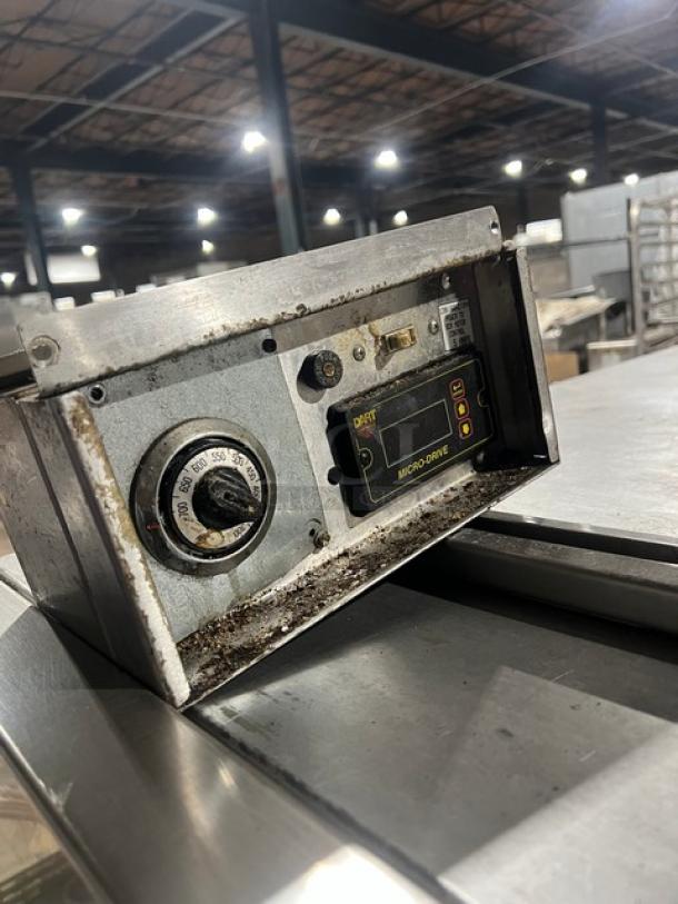 Micro Drive electric stainless steel conveyor pizza oven control panel, showing temperature dial and brand label, on a stand.