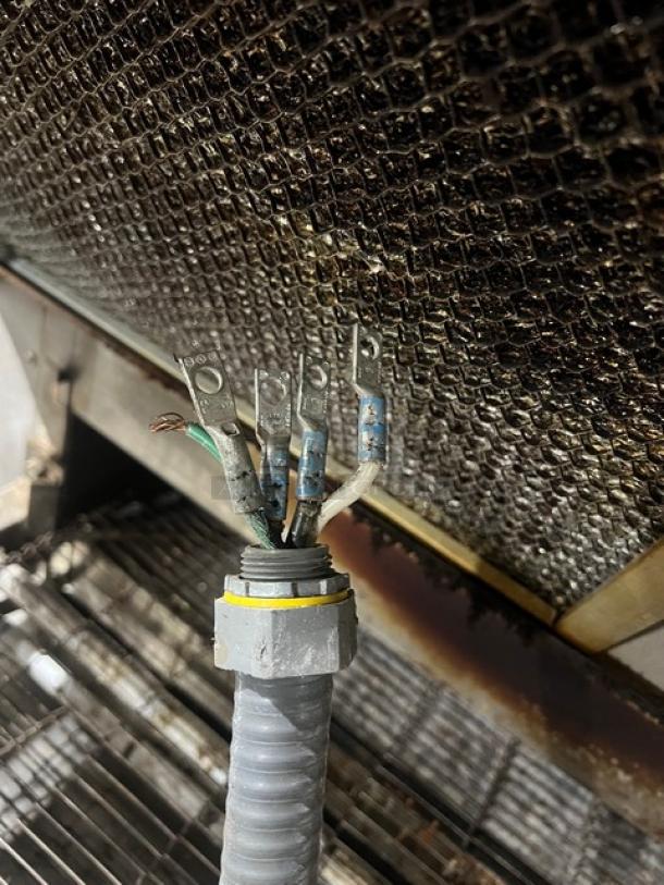 Micro Drive stainless steel conveyor pizza oven, electric powered, on stainless steel stand with casters, wiring detail shown.