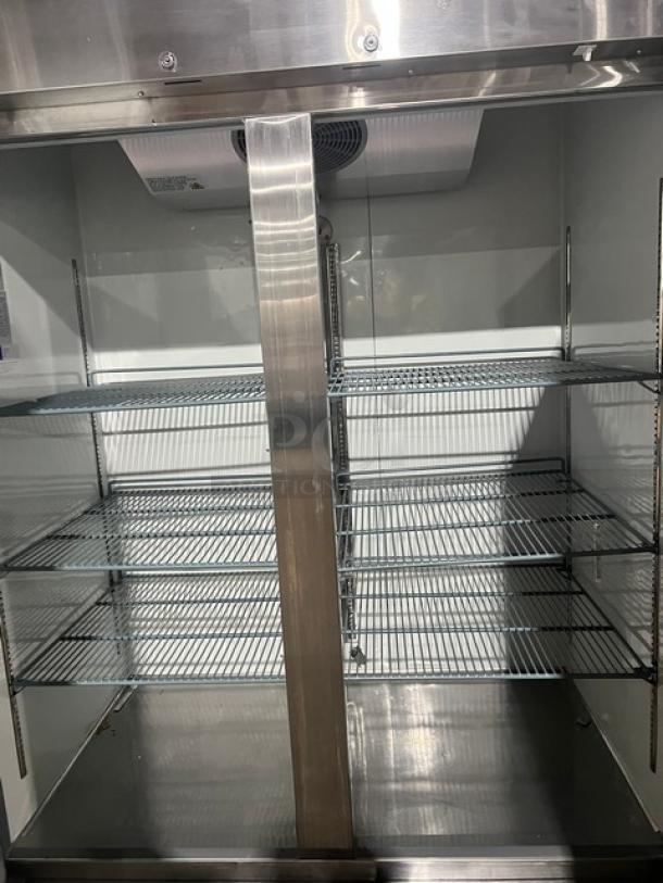 Avantco stainless steel 2-door reach-in freezer, Model 178A49FHC, on casters, featuring wire shelving and cooling vent.