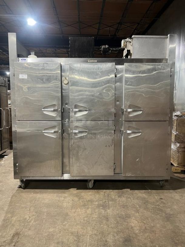 Traulsen 6 split door reach-in cooler with built-in pan racks on casters, 115V, 1 phase. Stainless steel, commercial use.