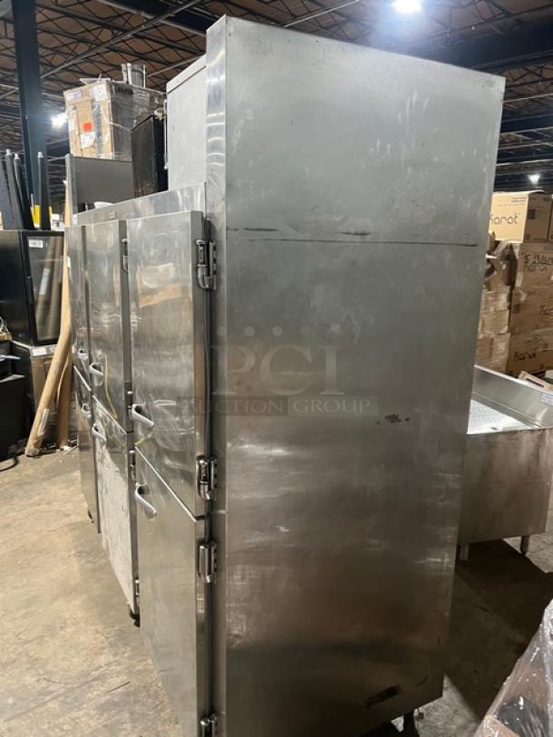 Traulsen 6 split door reach-in cooler with built-in pan racks and casters, 115V 1 phase, steel finish, in used condition.