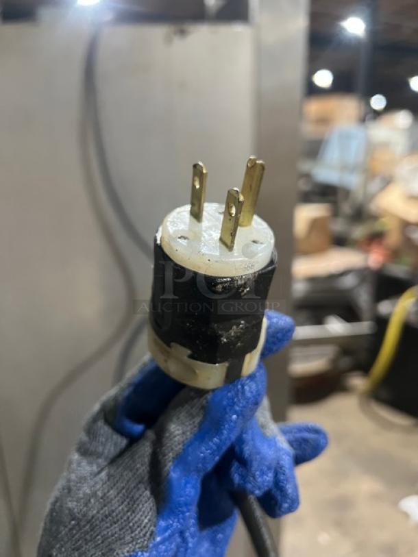 Traulsen 6 split door reach-in cooler plug, shows a three-prong electrical plug for 115V, 1 phase connection.