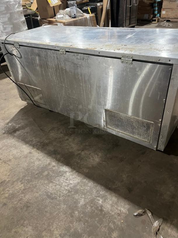 Continental 3 Door Under Counter Lowboy Cooler with racks, on casters, visible wear, 115V 1Phase.