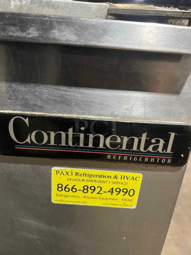 Continental 3 Door Under Counter Lowboy Cooler with racks, on casters. Visible service label and brand logo. 115V 1Phase.