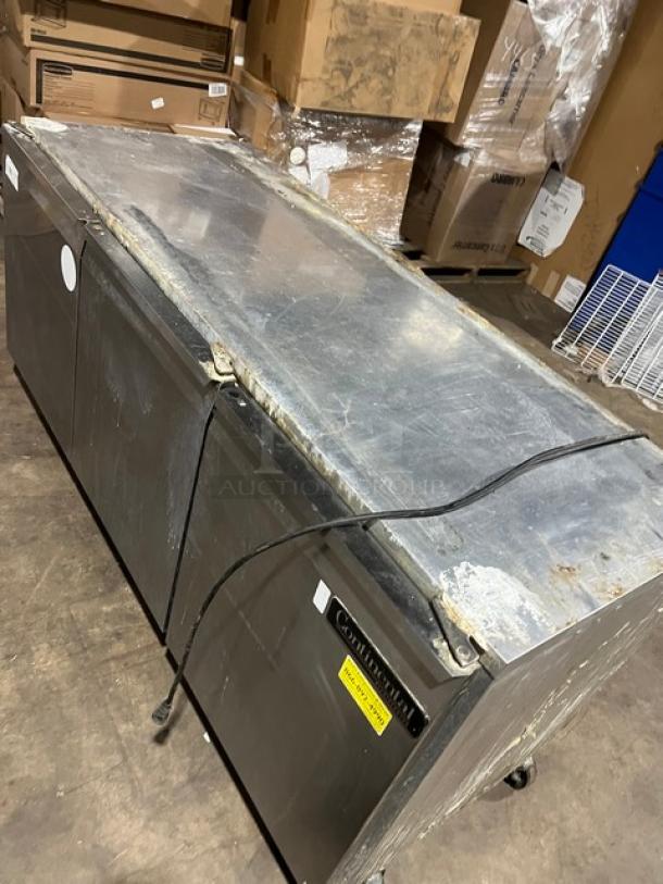Continental 3-door under-counter lowboy cooler with racks on casters, 115V 1-phase, used condition.
