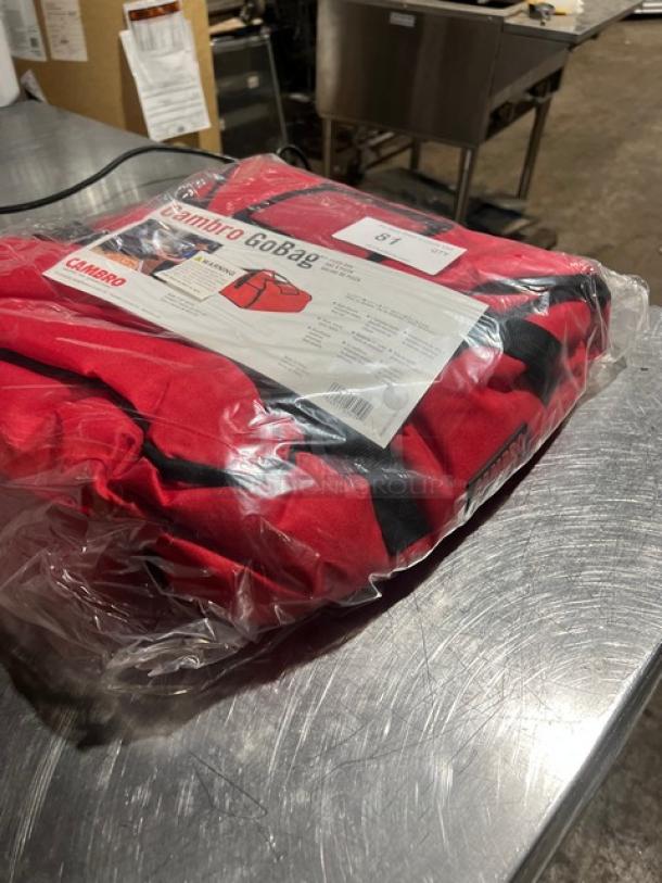 NEW Cambro Pizza To Go Bag in red, sealed in plastic. Features durable construction and Cambro branding. Ideal for keeping pizzas warm.