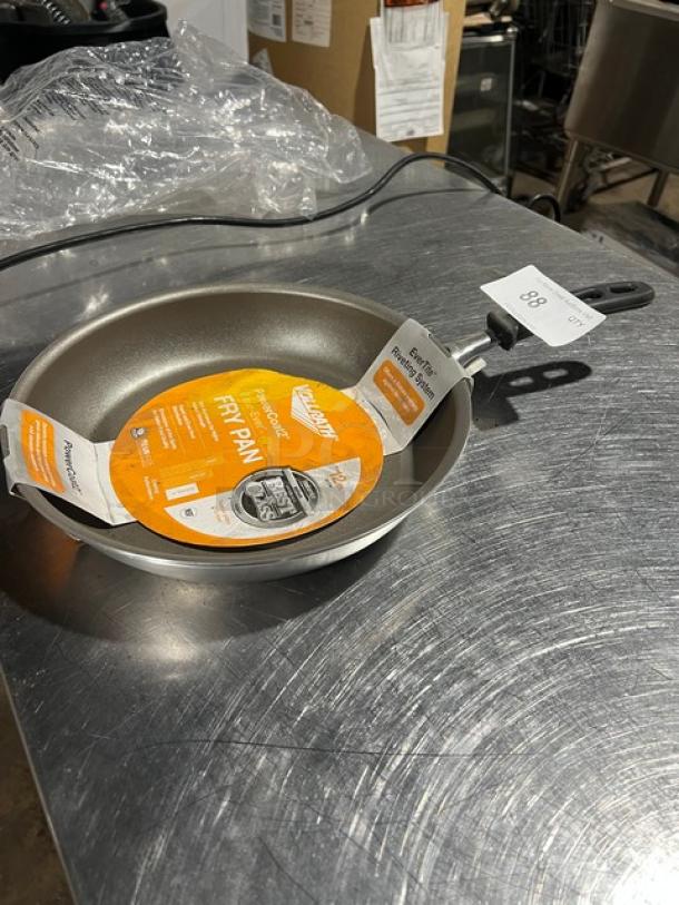 Vollrath Power Coat Wear-Ever frying pan, new condition, with orange label detailing features. Includes 2 pans per bid.