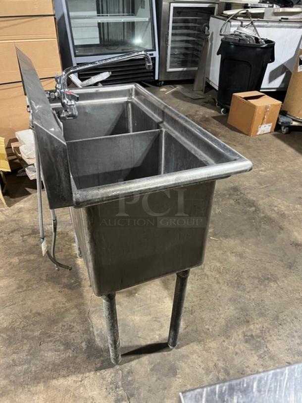 L & J stainless steel two-compartment wash/prep sink with faucet, well-maintained, sturdy construction, industrial use.