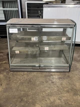 Vendo HFDC00002 electric food warmer, 3-tier, heated, glass display, model HFDC00002, serial 142345H, used condition.