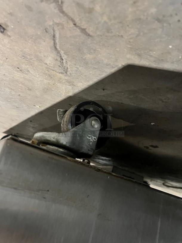 Caster wheel of Nuvu Subway Edition Baking Station, model SUB123. Appears to be in good condition.