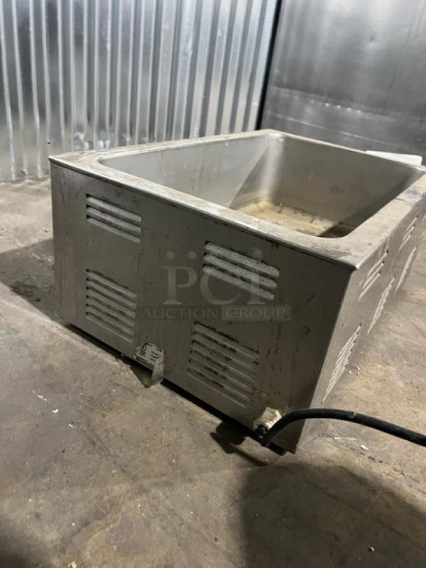 Qualite FW1200WF countertop food warmer, 115V, 1 Phase, sturdy metal construction, visible wear, vents on sides.