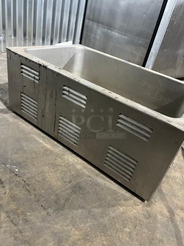 Qualite FW1200WF countertop food warmer, stainless steel, 115V, 1 phase, visible wear, ventilation slits on the sides.