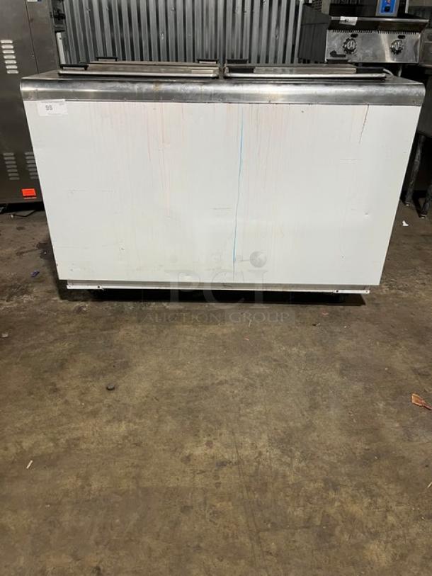 Kelvinator Commercial White Ice Cream Dipping Cabinet with flip-top lid, on casters, minor surface marks, good condition.