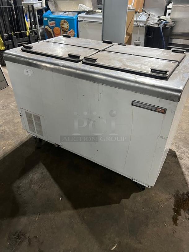 Kelvinator commercial ice cream dipping cabinet, white, flip-top lid, on casters, used condition, suitable for retail.