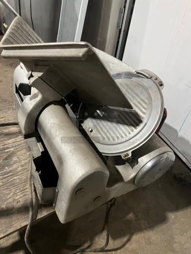 Hobart Model 1612 electric deli meat slicer, countertop design, used condition, serial number 11-128-507, metal construction.
