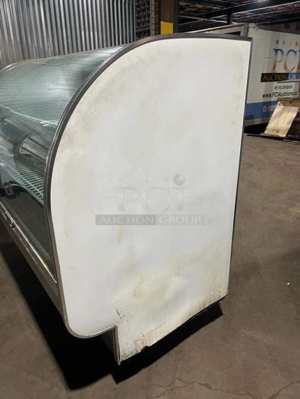 Leader commercial stainless steel curved glass bakery display case, 3-tier, model 115V 1 Phase, used condition.