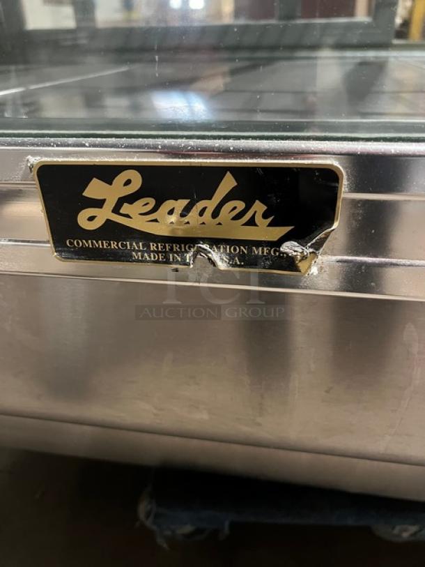 Leader stainless steel 3-tier bakery display case with curved glass, rear sliding doors, poly-coated wire rack, 115V 1 Phase.