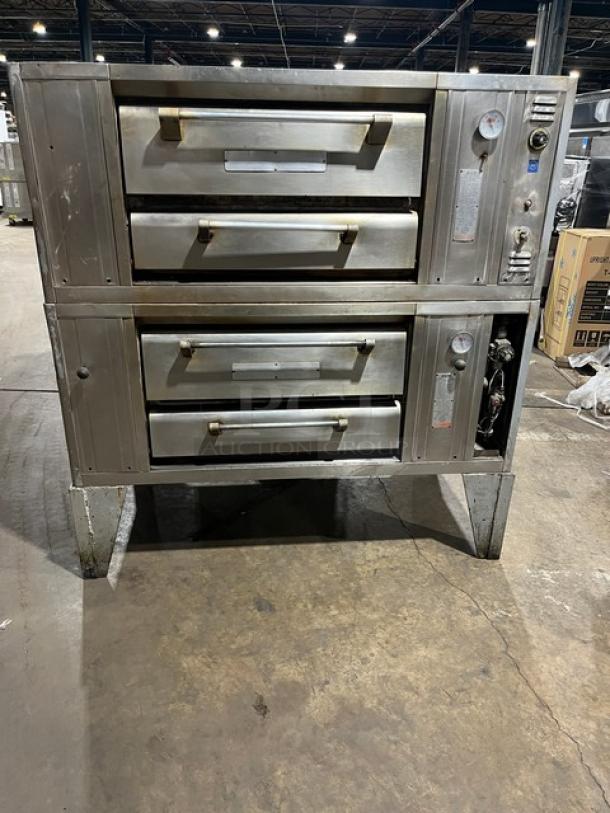 Bari M6PS natural gas double-stacked pizza oven, 4-pie capacity, on legs. Features control panel, sturdy condition. Model 2446.