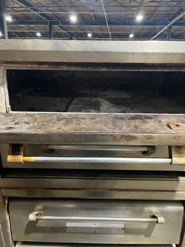 Bari model M6PS natural gas double-stacked pizza oven, holds 4 pies, in used condition, on legs, serial 2446.