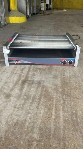 APW Wyott stainless steel hot dog roller grill, model HRS-755T, SN: HRS750622A0146. Countertop design, 208/240V, 1 phase, good condition.