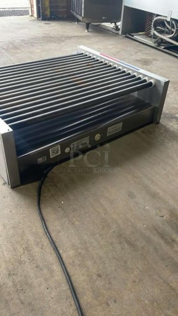 APW Wyott stainless steel countertop hot dog roller grill, model HRS-755T, in good condition. 208/240V, 1 phase.