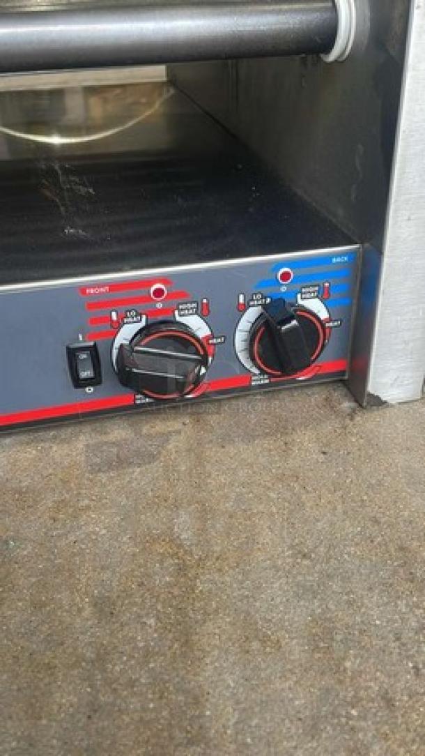 APW Wyott HRS-755T stainless steel hot dog roller grill, temperature dials visible, model HRS750622A0146, 208/240V, used condition.