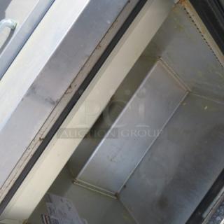 True TSSU-27-06-HC refrigerated prep table, one door, with two stainless steel shelves and 24-inch ticket rail, on casters.