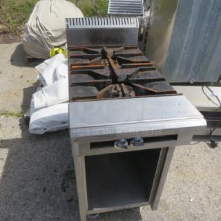 US Range natural gas 2 burner range, model 36-7, with under storage. Dimensions: 18x38x41 inches. Slight wear visible.